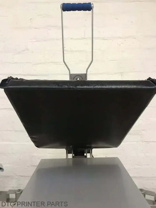 Rapid Slip Heat Press Upper Platen Cover 16X20: black trapezoidal platen, blue cushioned handle, steel frame over worktable.