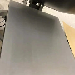 Rapid Slip Lower Platen Protector 11x15 shield with rounded corners mounted under a printer platen; black hinge visible.
