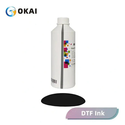 OKAI DTF INK white plastic bottle with a colorful square label, gray vertical stripe, and a black oval pad beneath. close-up